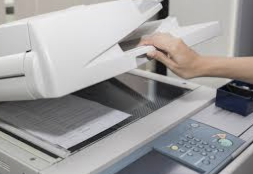 A photocopier is a machine that makes copies of documents and other visual images onto paper or plastic film quickly and cheaply.